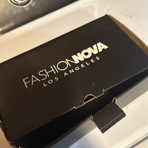 Fashion Nova woman’s black fishnet heel in size 11